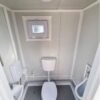 Container sanitario SCEW RAL 9002 Bianco grigiastro | A 2335 x L 1650 x P 1200 mm | porta a un'anta | con acqua calda